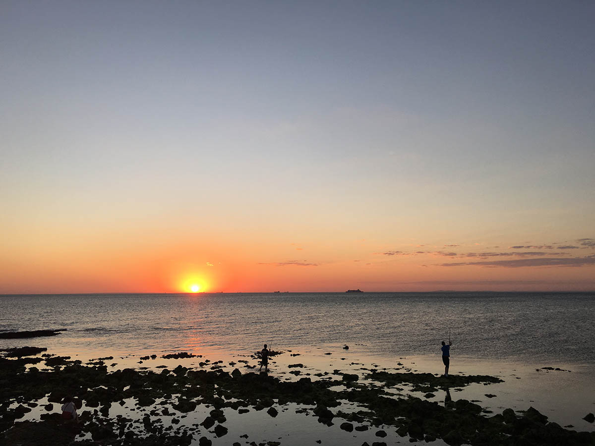 Fishermen in sunset